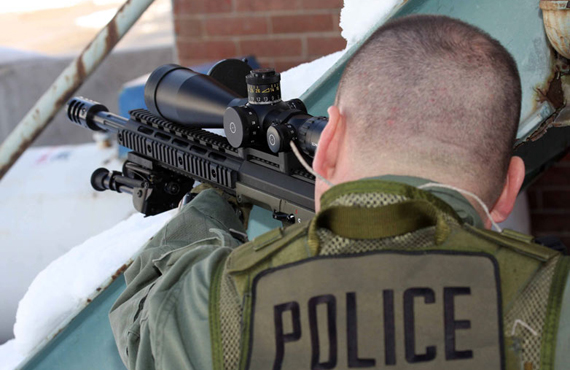 Desert Tactical Prototyping Slide 3 - Desert Tactical marketing image of police holding gun